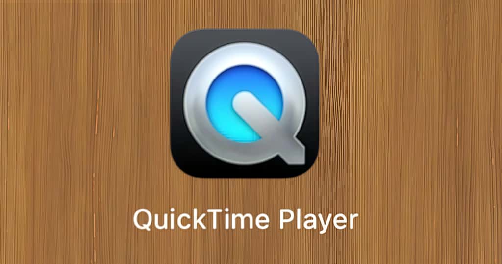 Una imagen del icono de la aplicación QuickTime Player sobre un fondo con textura de madera muestra las herramientas integradas de Mac para grabar pantalla y audio