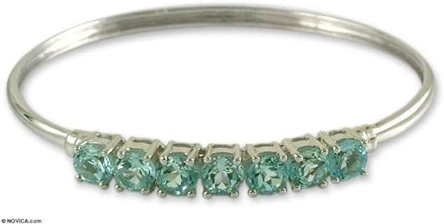 NOVICA Handmade Blue Topaz Bangle Bracelet .925 Sterling Silver Rhodium Plated India Birthstone [7.5 in Inner Circ. x 0.2 in W] 'Sparkling Blue'
